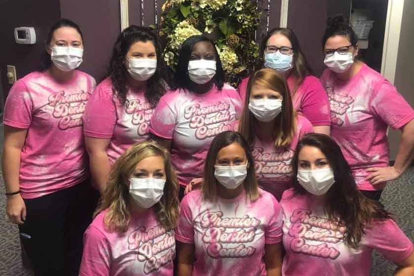 Premier Dental Center team members in masks