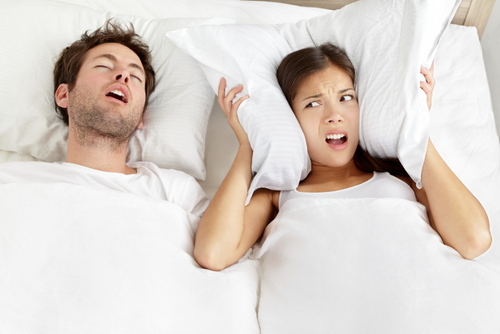 Snoring man in bed with wifell