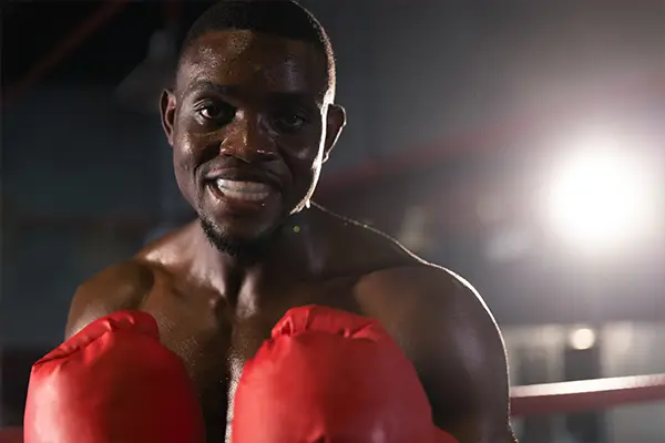 A boxer wearing a sports guard during training to protect his teeth and mouth from injury.